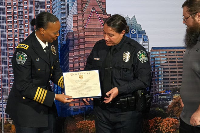 Interim Chief of Police Robin Henderson presents a graduation certificate to officer Angelica Avitia at the graduation ceremony for the Austin Police Department’s 151st Cadet Class at Bannockburn Church on Friday, April 19, 2024 in Austin. Avitia is one of 10 graduating women in the 151st Cadet Class, the largest group of women to graduate.