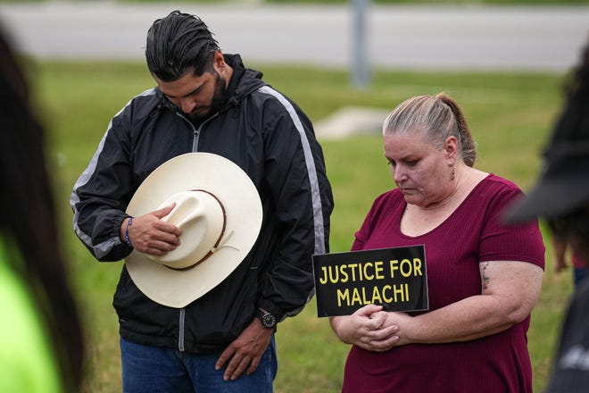 Community member Rene Castillo and her son Jesse Castillo bow their heads in prayer during a vigil for Malachi Williams outside San Marcos City Hall on Thursday, April 25, 2024 in San Marcos, Texas. Williams was killed by San Marcos Police on Thursday, April 11, 2024.