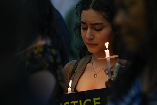 Kyle resident Andrea Elizondo holds a candle at a vigil for Malachi Williams outside the San Marcos Public Library on Thursday, April 25, 2024 in San Marcos, Texas. Williams was killed by San Marcos Police on Thursday, April 11, 2024.