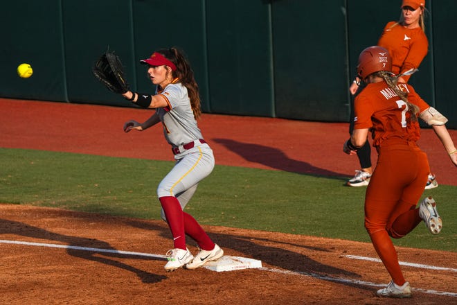 Iowa State infielder Carli Spelhaug (1) catches the ball at first in front of Texas Longhorns outfielder Ashton Maloney (7) during the game at Red and Charline McCombs Field on Friday, April 26, 2024 in Austin.