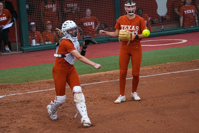 Texas Longhorns catcher Reese Atwood (14) throws the ball to first during the game against Iowa State at Red and Charline McCombs Field on Friday, April 26, 2024 in Austin.
